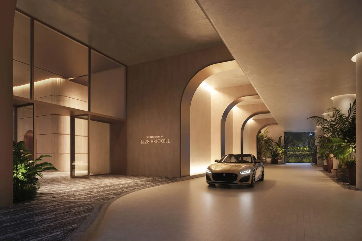 Condominium refinancing for a luxurious hotel lobby featuring elegant decor and a car prominently parked in the center, showcasing opulence and style. Linkvest Capital
